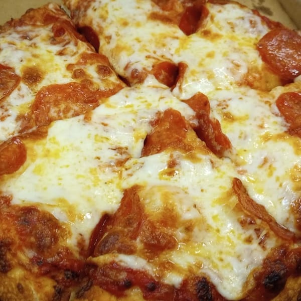 Close-up of a freshly baked Bobo's Pizza pepperoni pizza, with melted cheese and crispy crust.